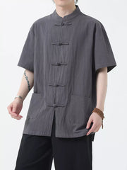 Dark Gray short-sleeve cotton shirt with mandarin collar and frog button closure, featuring two front pockets.
