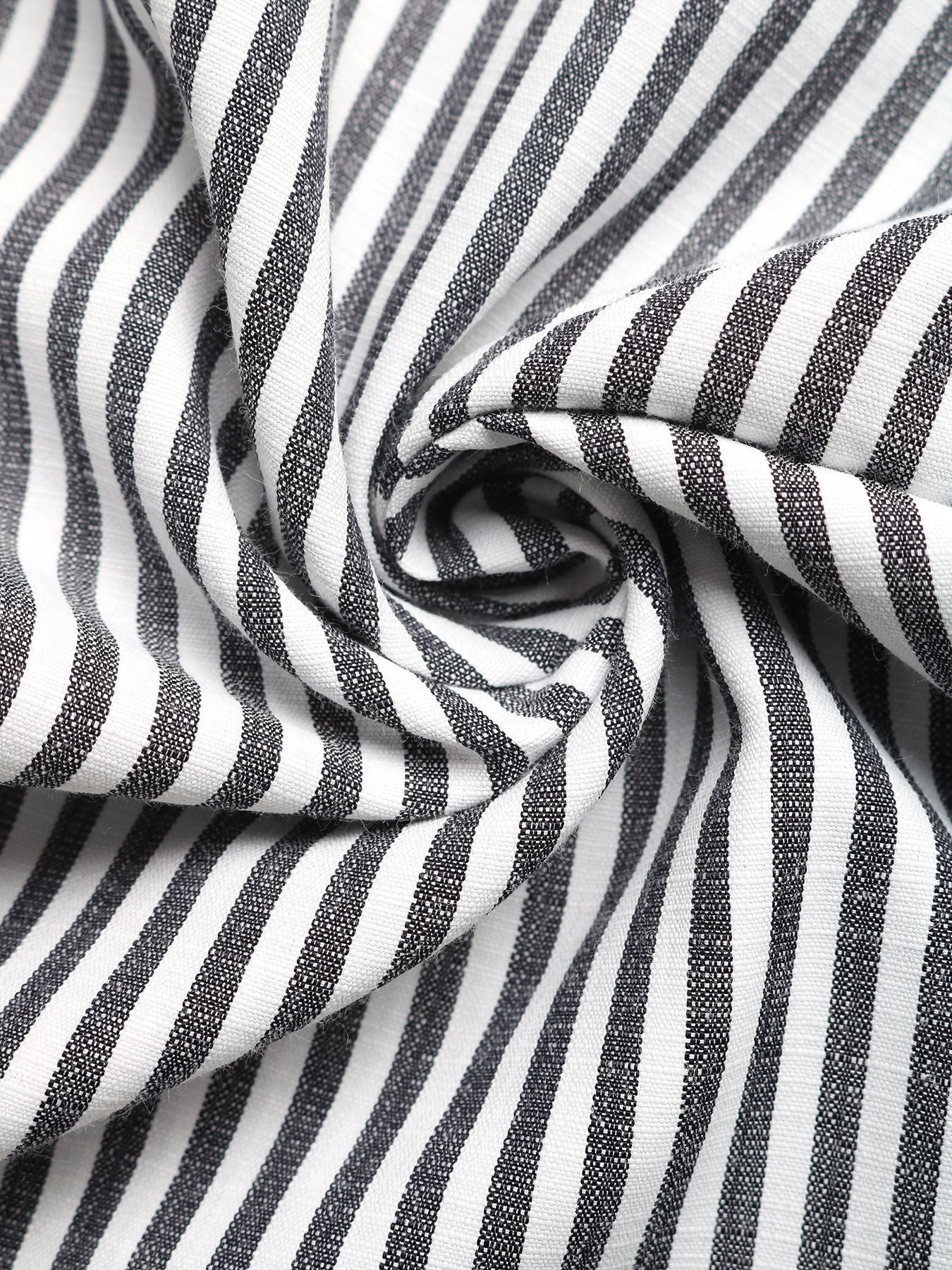 Striped cotton blend romper fabric detail, black and white vertical stripes.