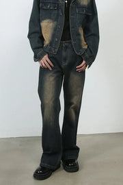 Dark faded denim flare jeans with a vintage wash and baggy fit.