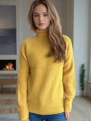 Yellow ribbed turtleneck sweater with raglan sleeves and a casual fit.