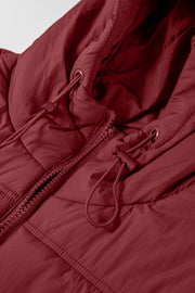 Burgundy quilted hooded puffer vest with adjustable drawcords and zipper detail.