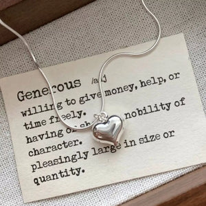 Sleek sterling silver heart pendant necklace with snake chain.