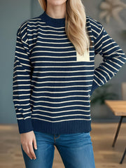 Dark blue and cream striped knit sweater with asymmetrical pocket detail.