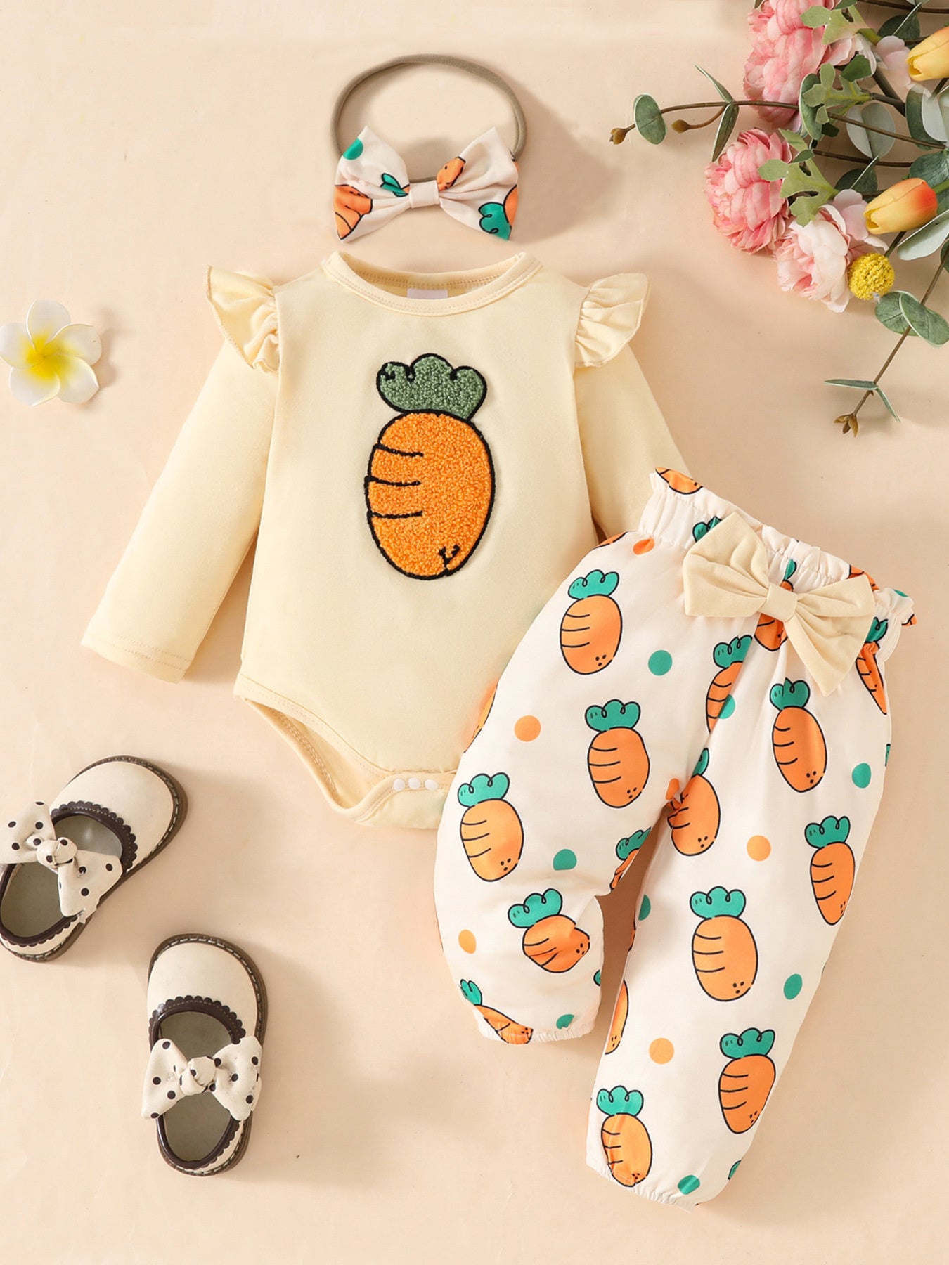 Baby girl yellow long sleeve bodysuit with carrot appliqué and matching carrot print pants with bow.