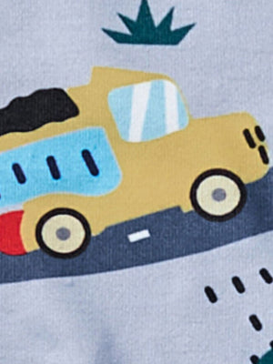 Toddler sleepwear with a yellow dump truck graphic and green grass detail.