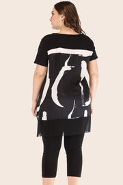 Black tunic with brushstroke overlay and matching leggings.