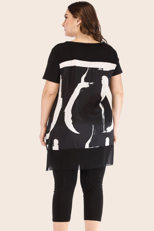 Black tunic with brushstroke overlay and matching leggings.