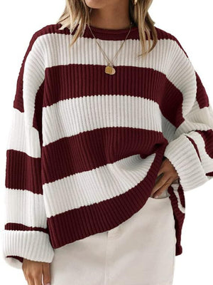 Burgundy and white striped oversized knit sweater with crew neck and cuffed sleeves.