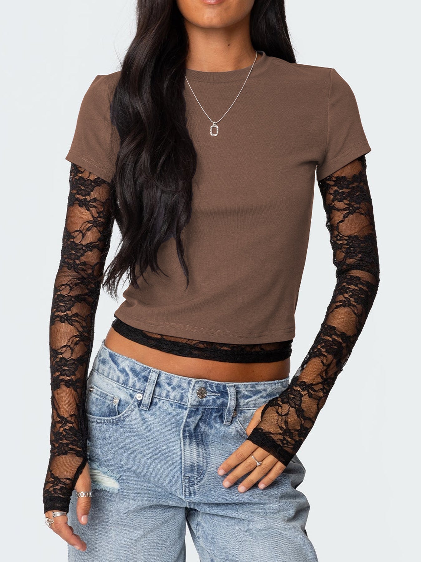 Brown crew neck t-shirt with black lace long sleeves and fingerless gloves.