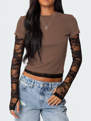 Brown crew neck t-shirt with black lace long sleeves and fingerless gloves.