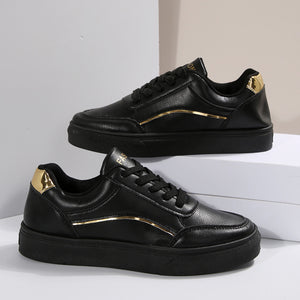 Black lace-up casual sneakers with gold accents and premium material.