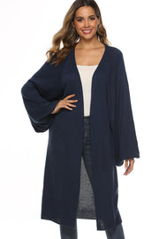 Dark blue oversized sleeve maxi knit cardigan with open front and relaxed fit.