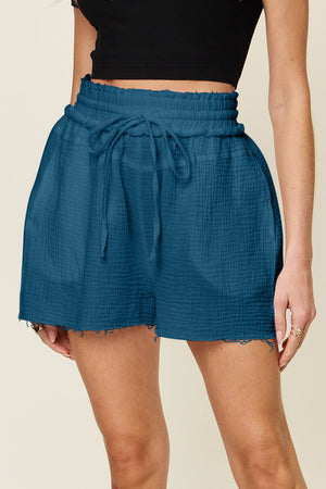 Dark blue textured gauze drawstring waist shorts with raw hem