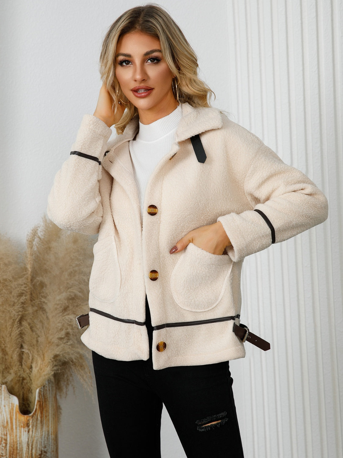 Teddy textured jacket in cream with leatherette trim and button closure.