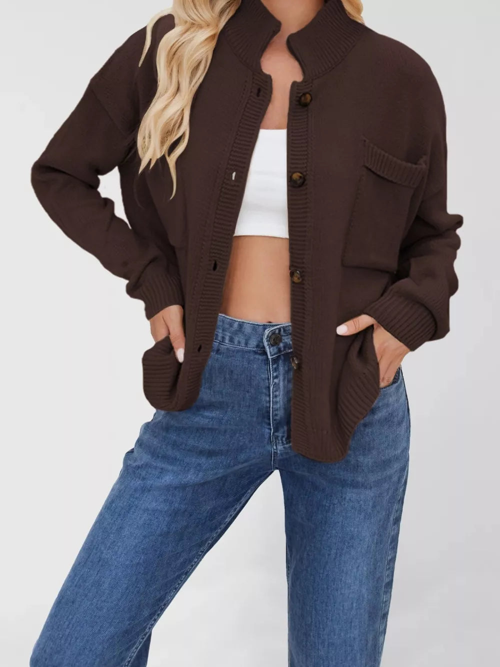 Brown knit cardigan with button-down front and two chest pockets.