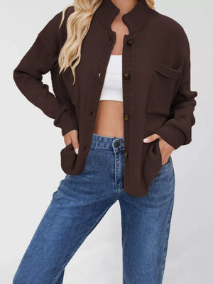 Brown knit cardigan with button-down front and two chest pockets.