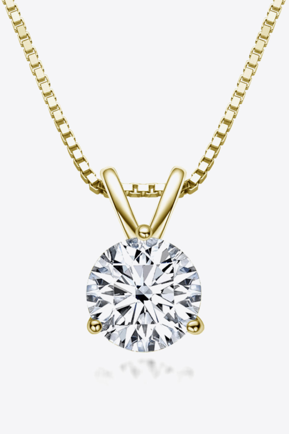 Gold box chain necklace with a round brilliant cut solitaire moissanite pendant.