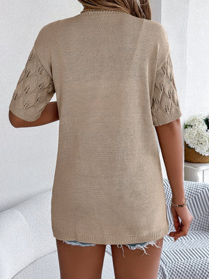 Tan open-knit cardigan with leaf motif sleeves and a crew neck.