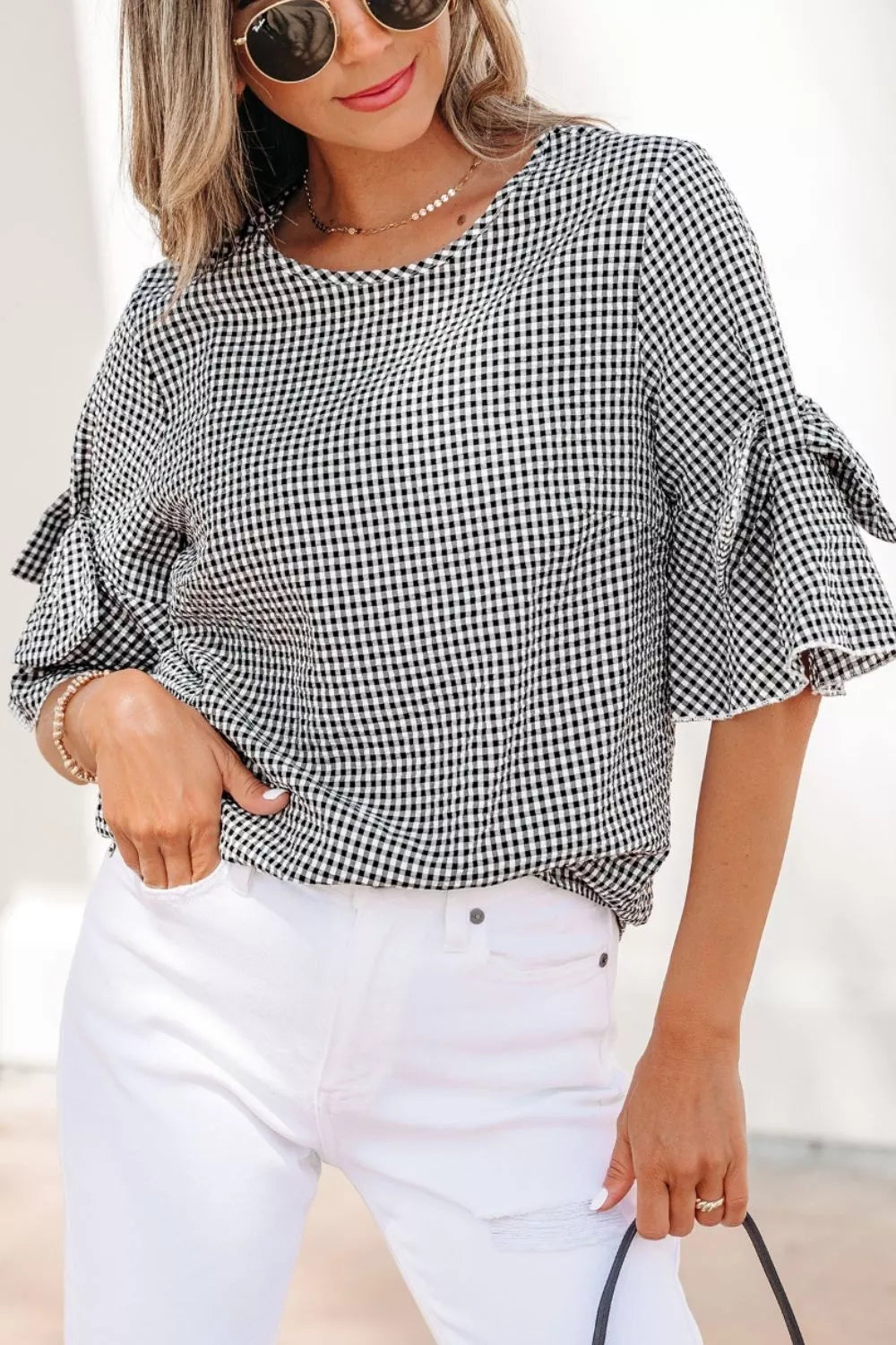 Black and white gingham shirt with ruffled bow tie sleeves