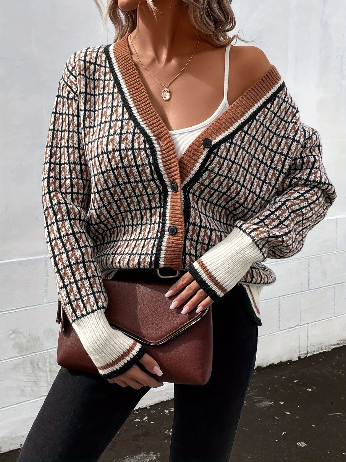 Geometric knit cardigan in caramel with button front and contrast trim.