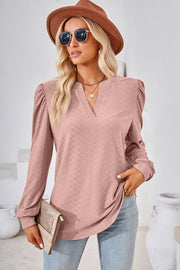 Blush pink textured henley blouse with puff sleeves and v-neck