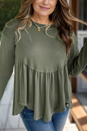 Moss ribbed peplum blouse with long sleeves and a tiered hem.