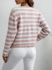 Pink and white horizontal stripe knit cardigan with pockets, crew neck, long sleeves.
