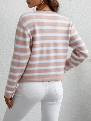 Pink and white horizontal stripe knit cardigan with pockets, crew neck, long sleeves.