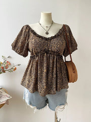 Plus size coffee brown paisley print blouse with ruffled neckline and short sleeves.