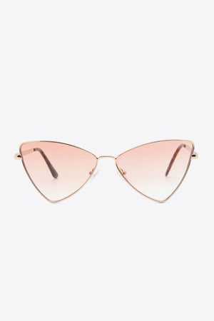 Angular cat-eye sunglasses with gradient brown lenses and gold metal frames.