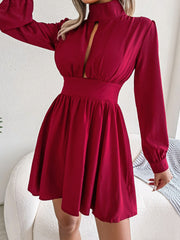 Red fit-and-flare mini dress with keyhole neckline and long sleeves