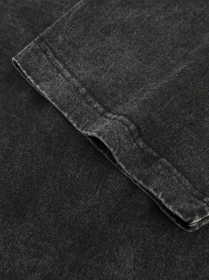 Acid wash oversized crew neck tee in Washed Black showing textured fabric detail.