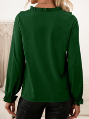 Dark green ruffled yoke blouson sleeve top with ruffled cuffs.