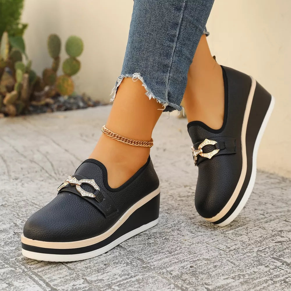 Black wedge loafers with buckle detail and layered sole