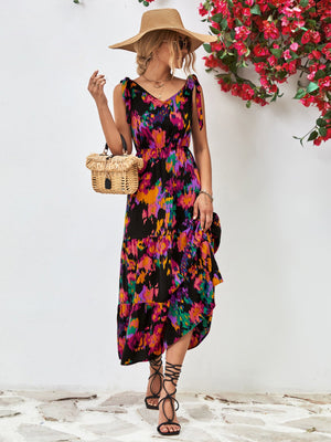 Maxi dress with abstract print, tie straps, and tiered ruffle hem.