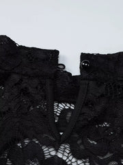 Black lace mini dress with cutout detail and button closure at the neck.
