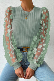 Sage knit top with sheer floral appliqué puff sleeves and crew neck