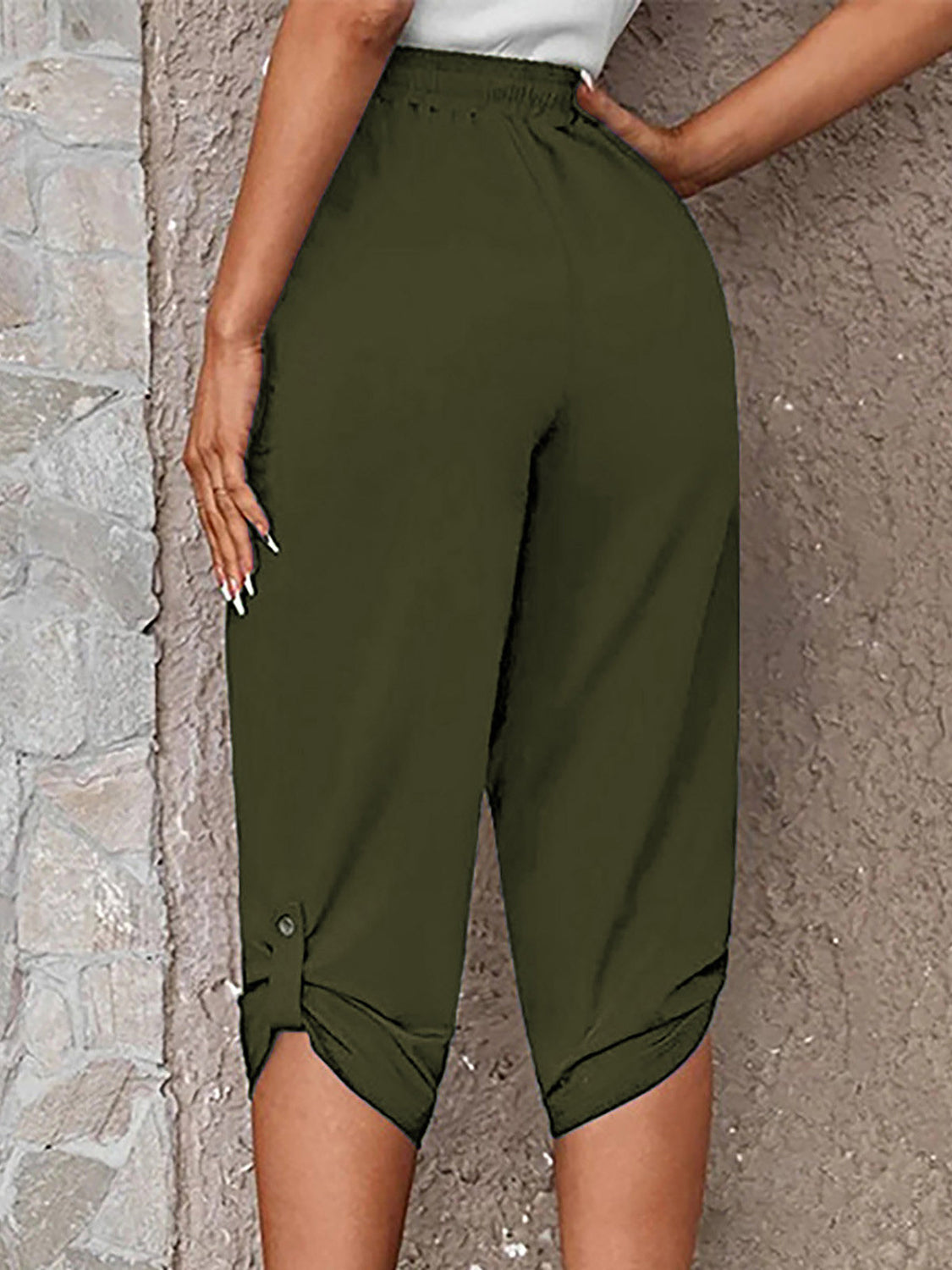 Button-detail cropped culottes in Matcha Green with a cinched hem and button accent.