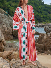 Boho print maxi beach cover-up with tie waist and geometric pattern in red and green.