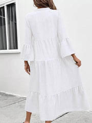 White tiered ruffle hem midi dress with bell sleeves and V-neck.