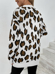 White leopard print knit open-front cardigan with long sleeves.