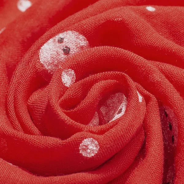 Red scarf with a cheerful white snowman print, soft fabric detail