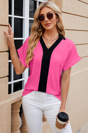 Hot Pink blouson top with black V-neck contrast panel and cuffed short sleeves.
