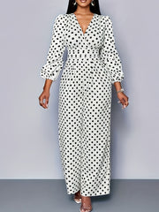 Chic white polka dot wide-leg jumpsuit with balloon sleeves and V-neck.