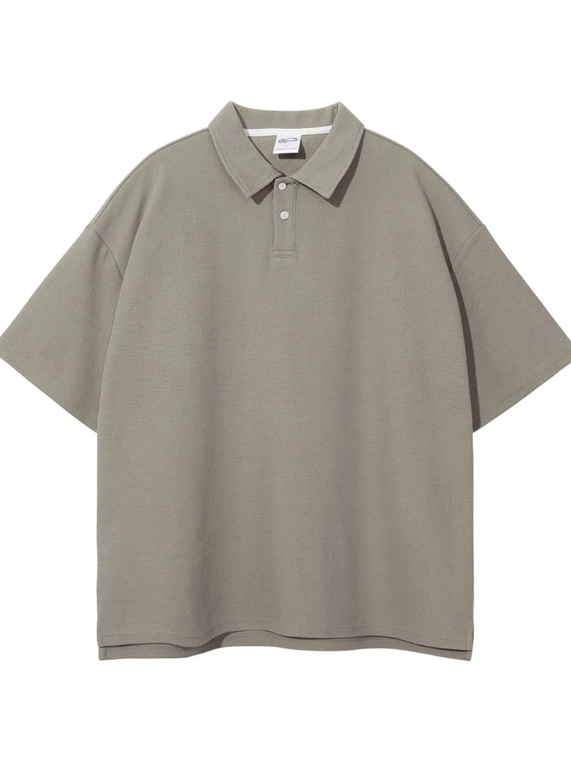 Boxy textured polo shirt in Khaki with short sleeves and a two-button placket.