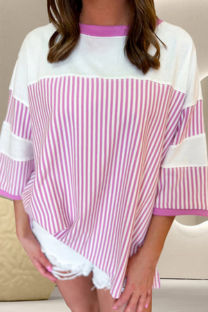 Pink and white striped 3/4 sleeve t-shirt with a crew neck and colorblock detail.