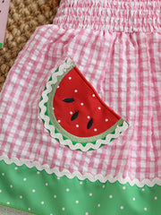Smocked baby dress with pink gingham, watermelon pocket, and green polka dot trim.