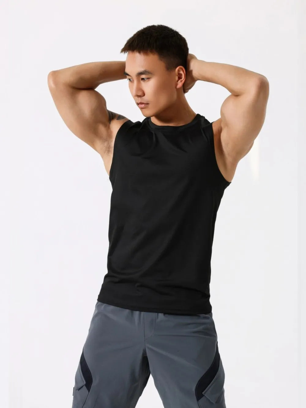 Black performance sleeveless crew neck tank top with breathable fabric.