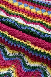 Multicolor crochet wave knit sweater with openwork details and a chevron pattern in pink, yellow, green, blue, and white.
