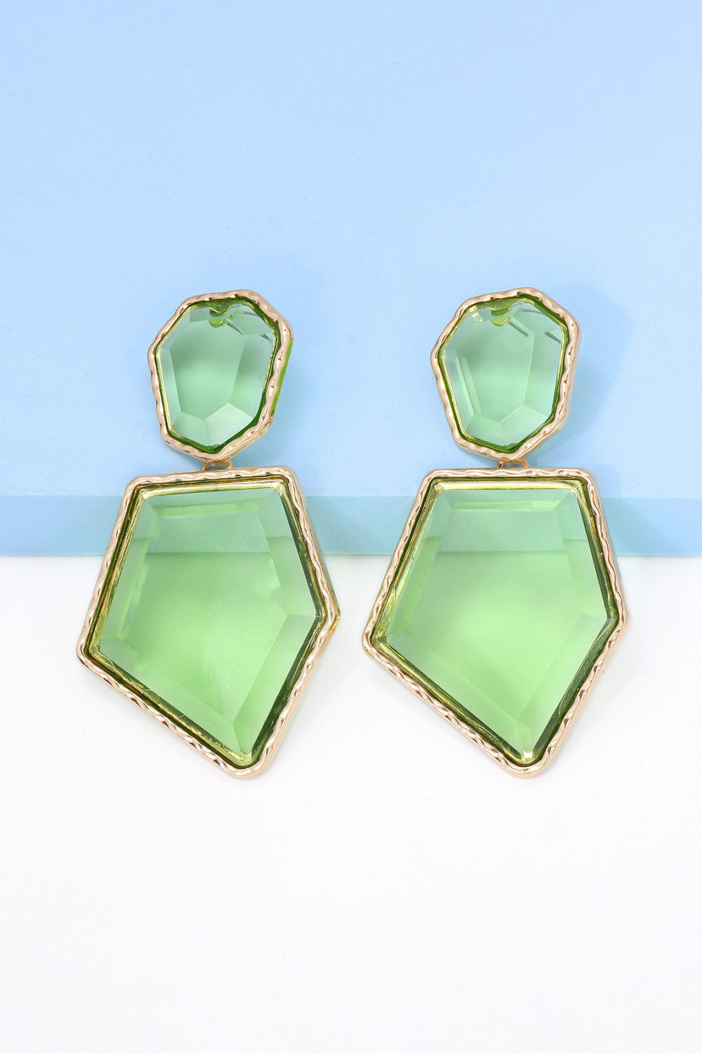 Neon green resin facet drop earrings with gold trim.